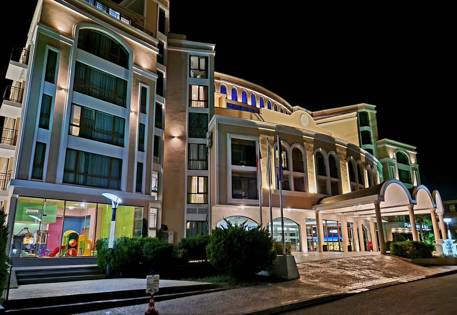 The illuminated night facade of the Grand Hotel Sveti Vlas complex